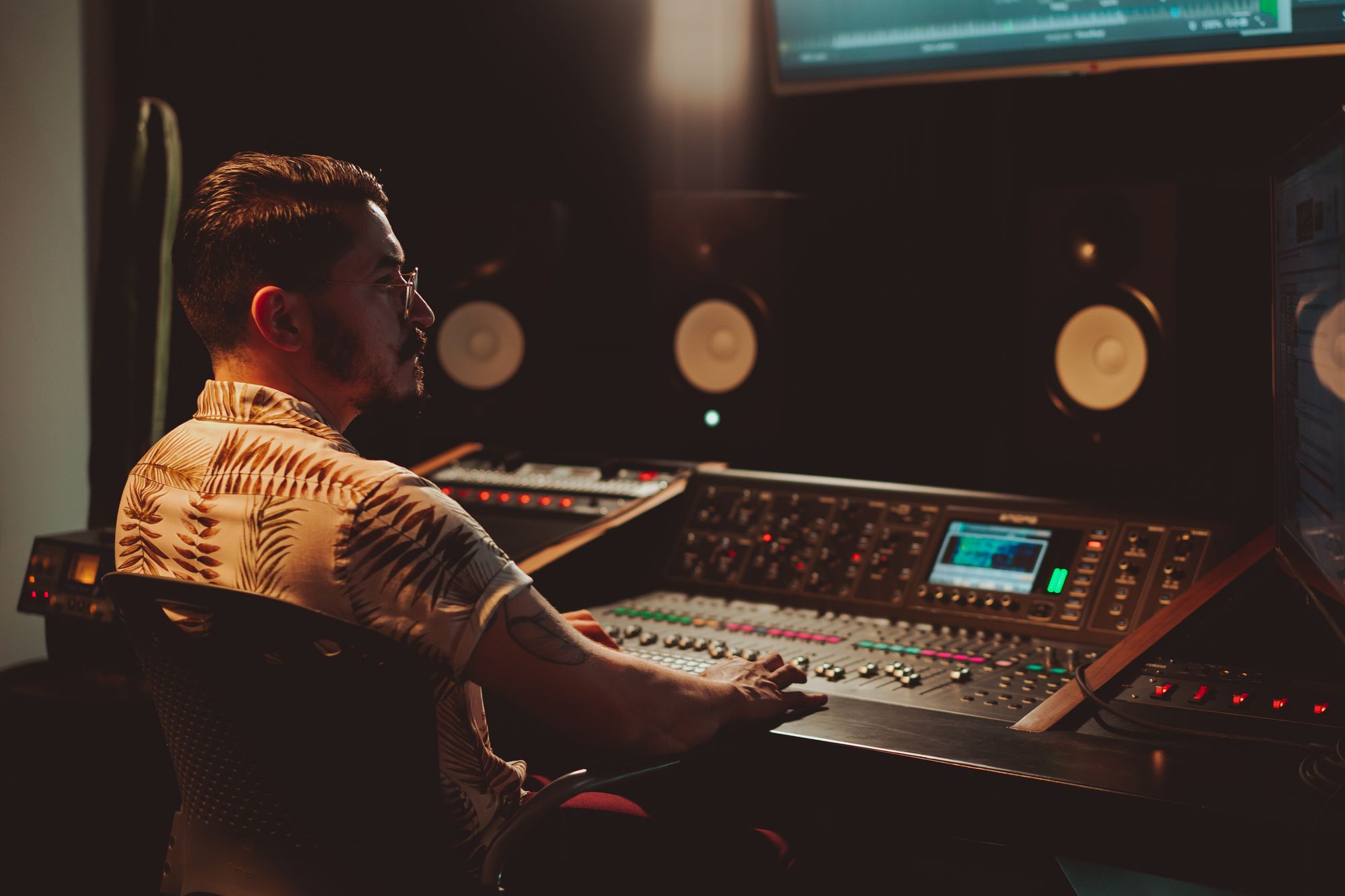 Audio engineer working at a mixing console