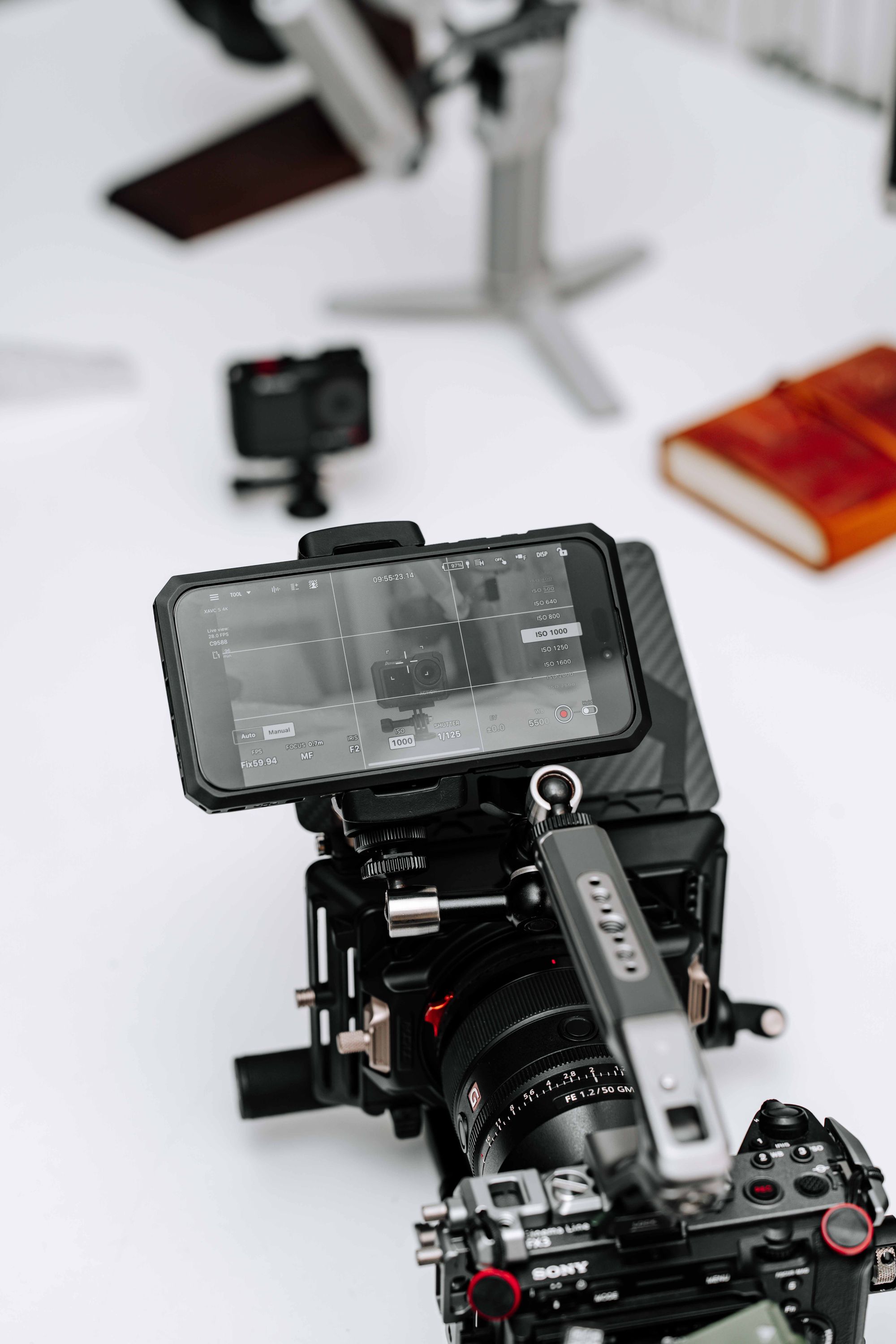 A production monitor mounted above a compact cinema camera rig